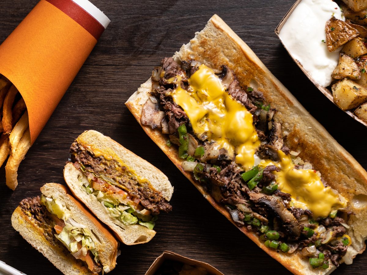 A double cheeseburger fresh off the grill in Marcello's kitchen